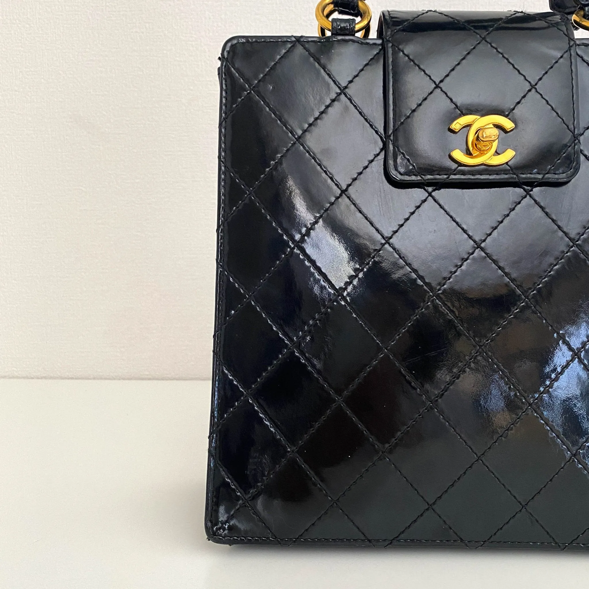 CC Turnlock Patent Hand Bag