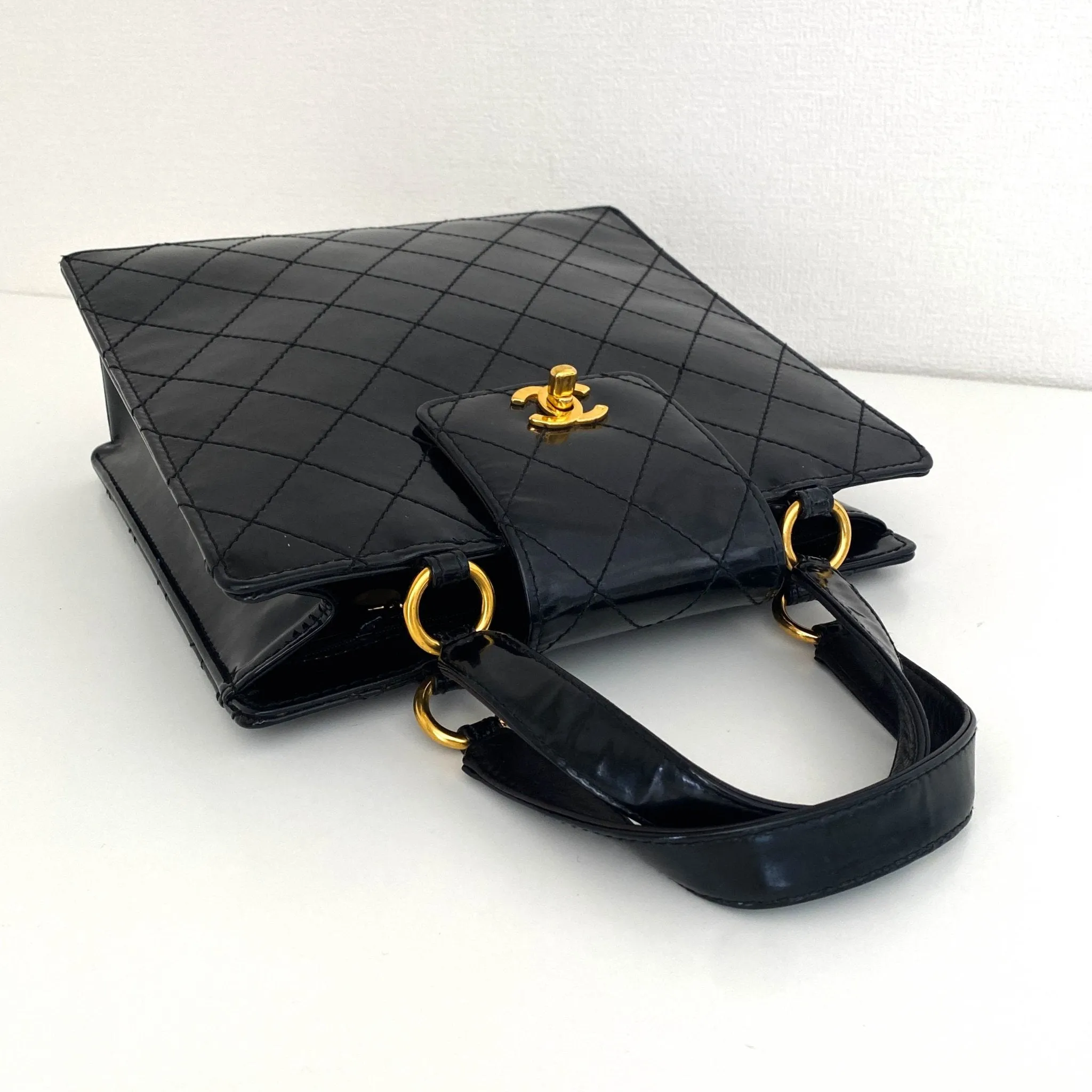 CC Turnlock Patent Hand Bag