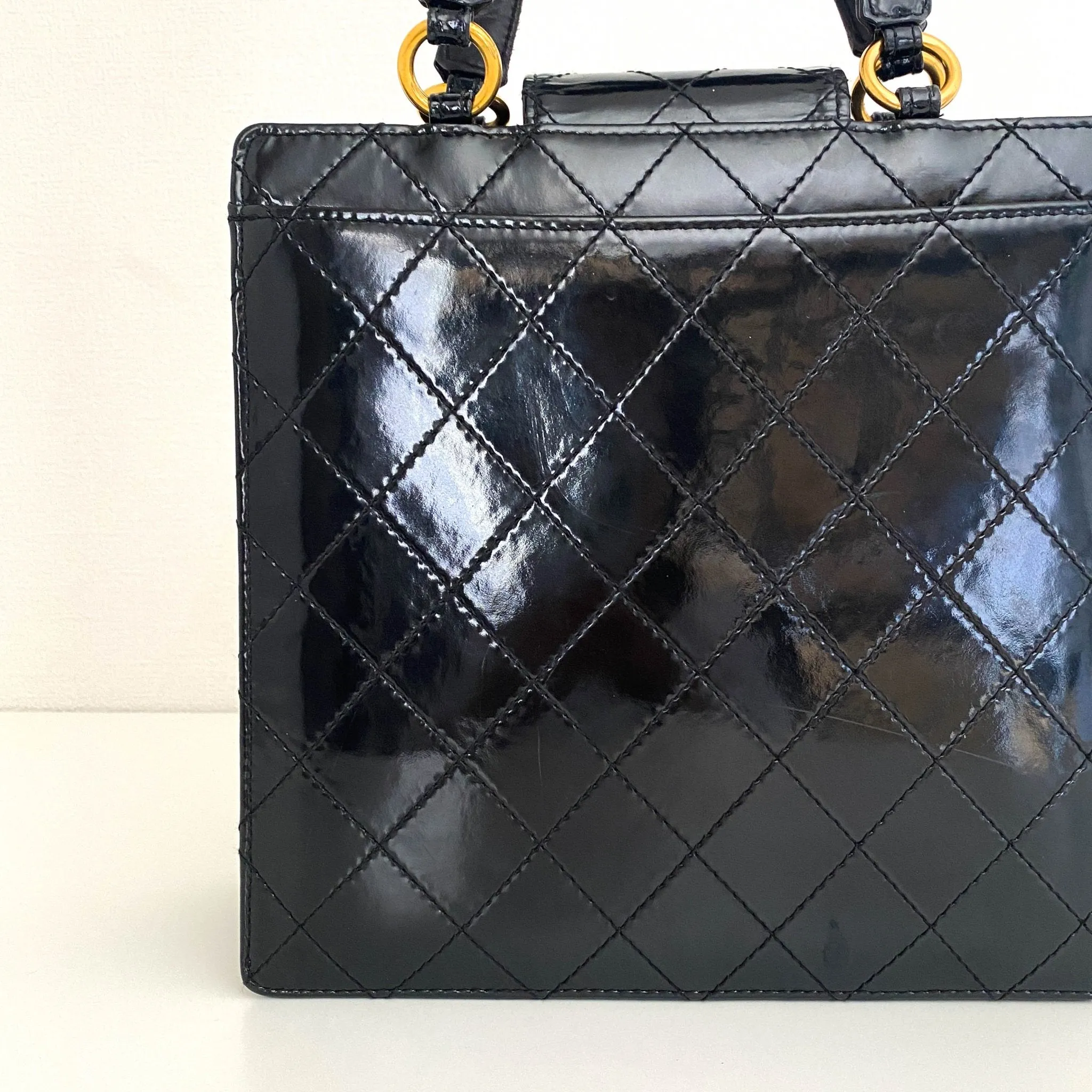 CC Turnlock Patent Hand Bag
