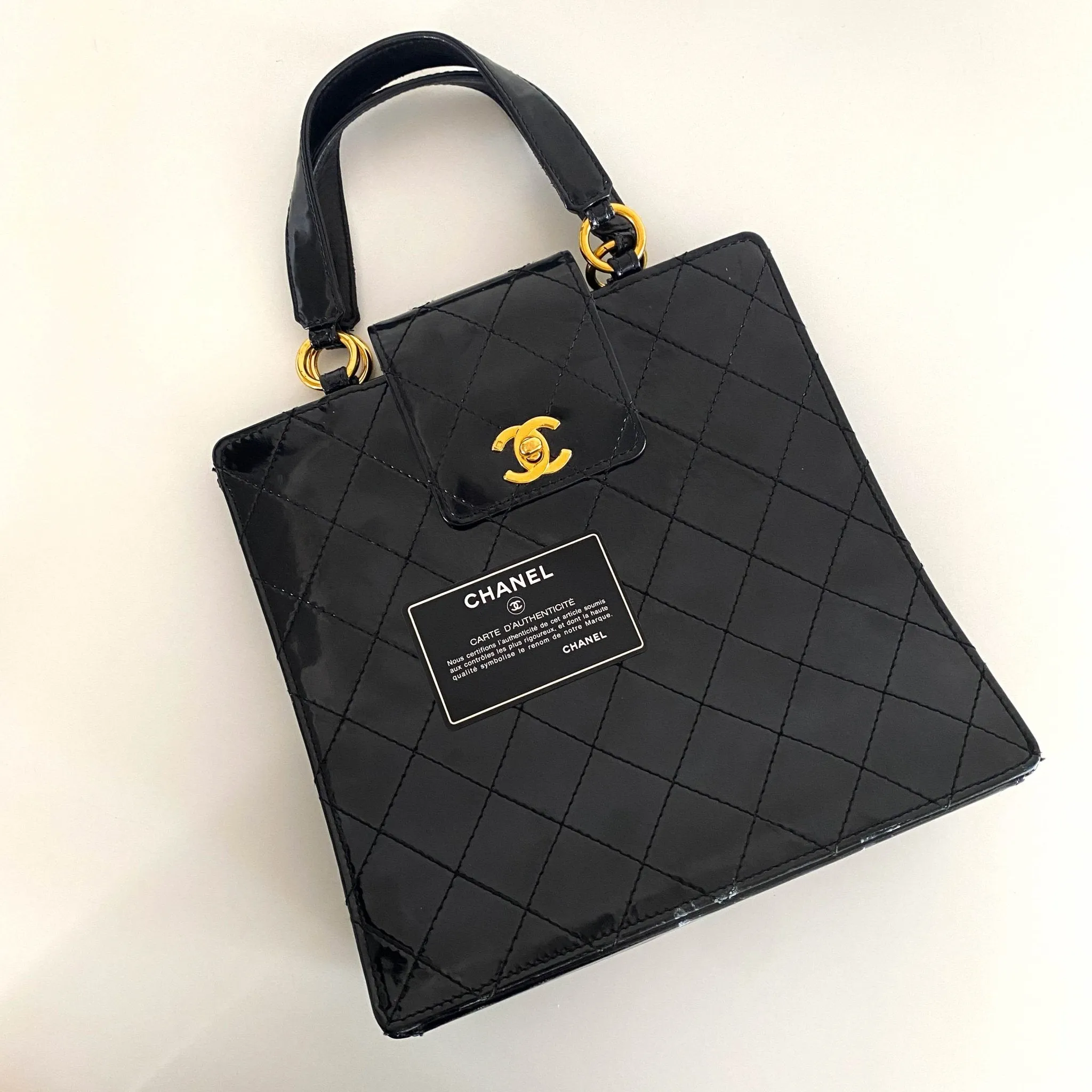 CC Turnlock Patent Hand Bag
